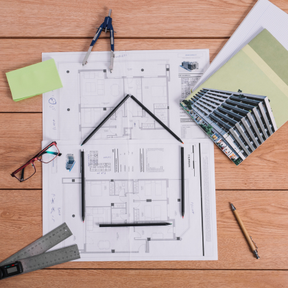 ADU floor plan design with architectural tools on desk – Best ADU LA